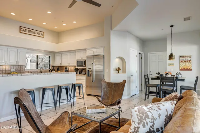 a bathroom with a sink vanity granite and a mirror