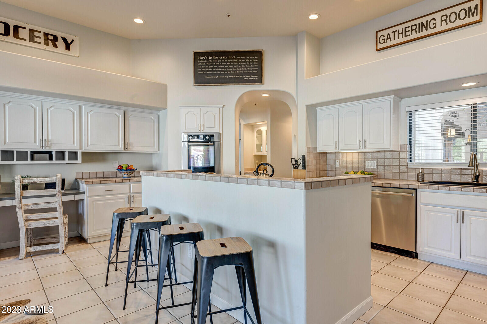 8161 East Alameda Road Scottsdale, AZ 85255 - Photo 20 of 107 a kitchen with cabinets and chairs