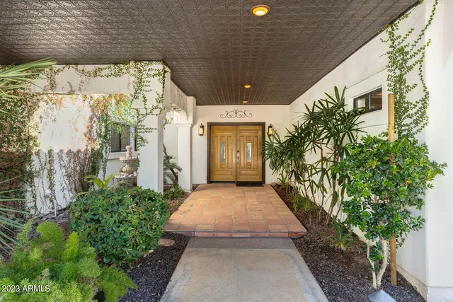 a front view of a house with trees