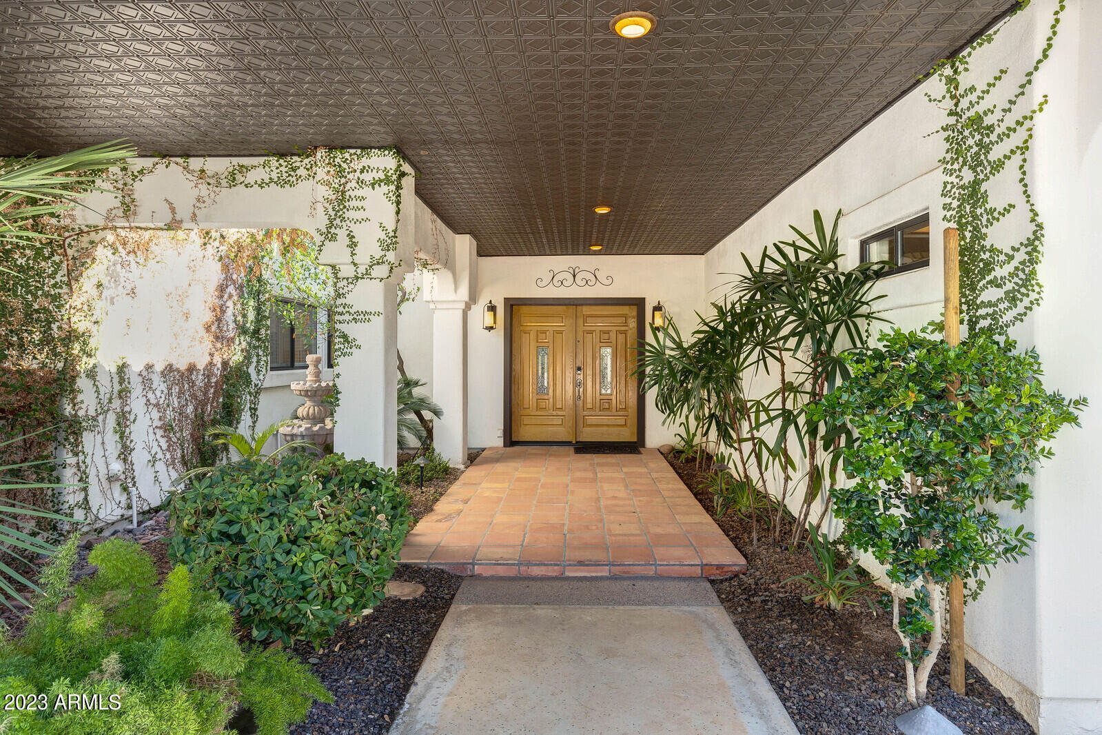 8161 East Alameda Road Scottsdale, AZ 85255 - Photo 2 of 107 a front view of a house with trees