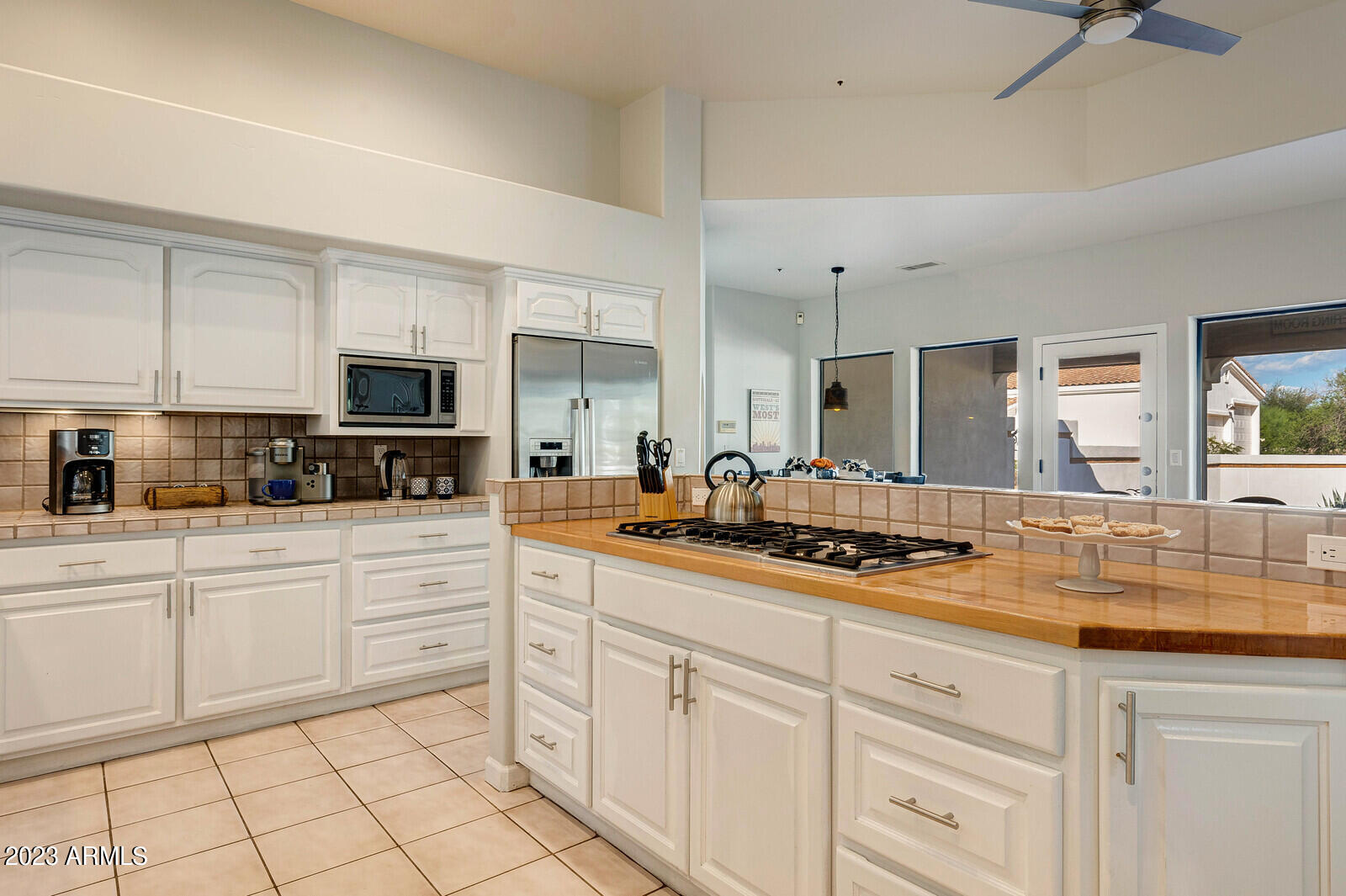 8161 East Alameda Road Scottsdale, AZ 85255 - Photo 21 of 107 a kitchen with white cabinets