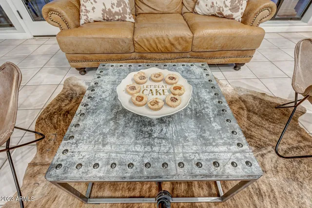 a bathroom with a granite countertop sink a toilet and a large mirror