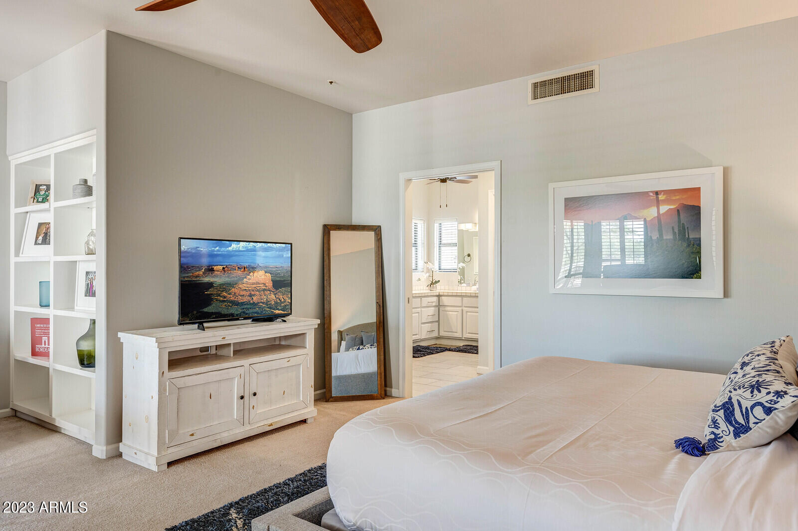 8161 East Alameda Road Scottsdale, AZ 85255 - Photo 32 of 107 a bedroom with a bed and flat screen tv