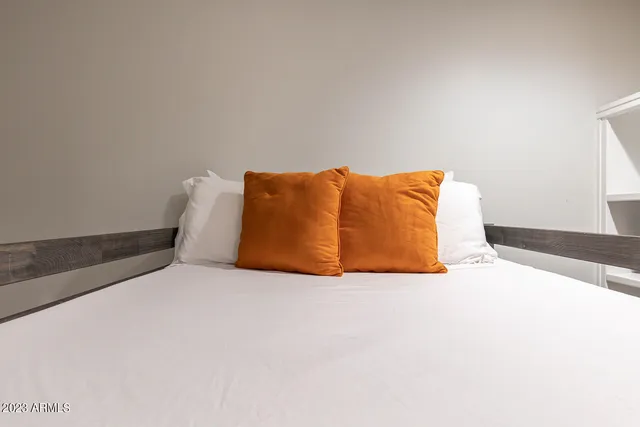 a view of a house with backyard porch and sitting area