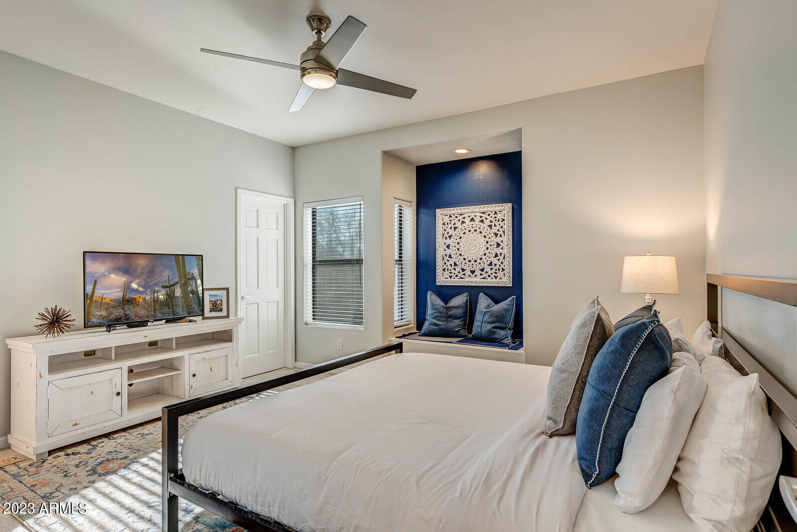 8161 East Alameda Road Scottsdale, AZ 85255 - Photo 42 of 107 a bedroom with a bed and a flat screen tv in it