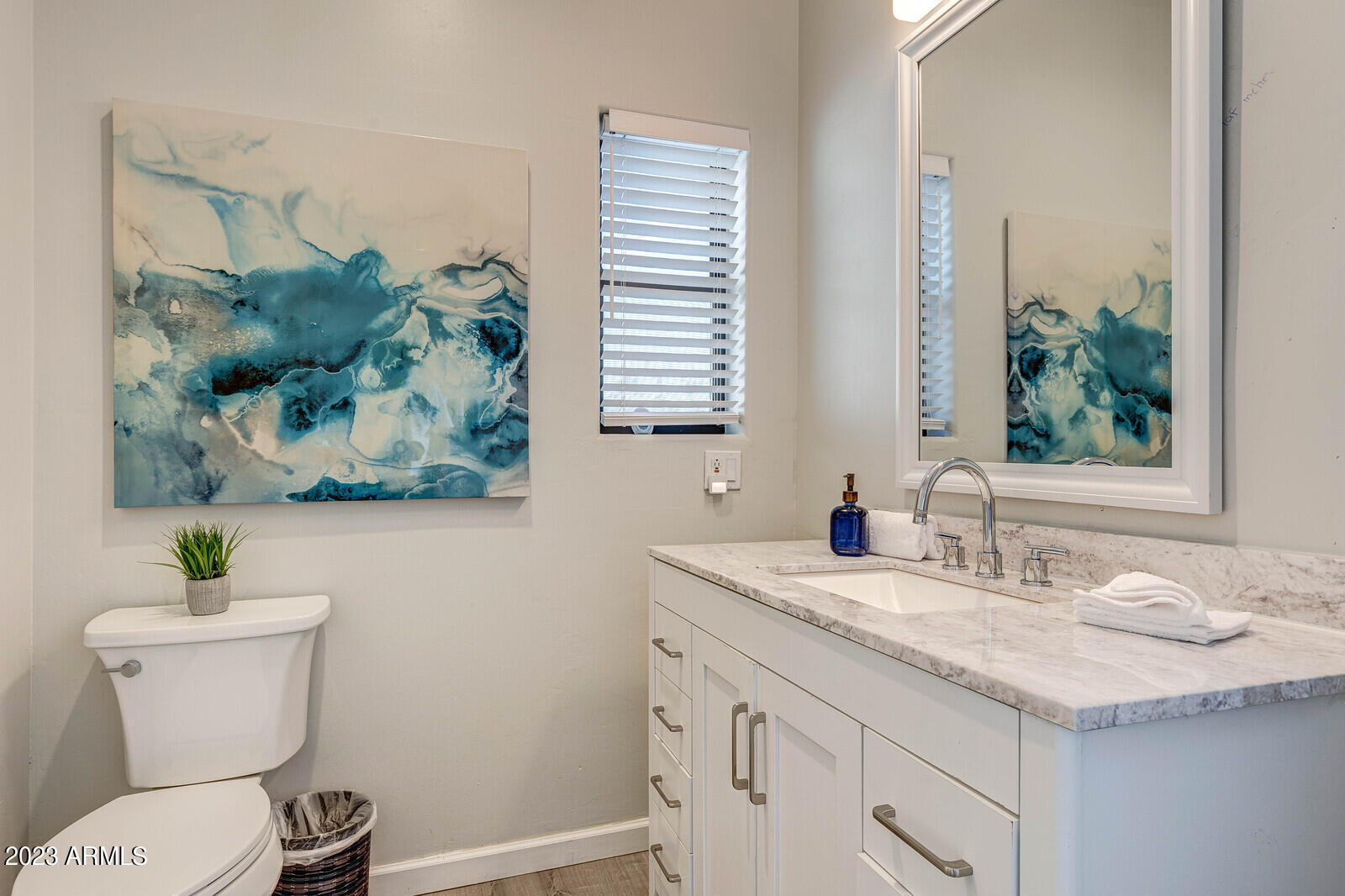 8161 East Alameda Road Scottsdale, AZ 85255 - Photo 55 of 107 a bathroom with a granite countertop sink a toilet and a mirror