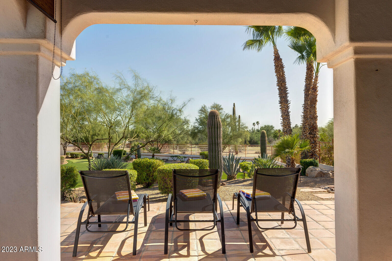 8161 East Alameda Road Scottsdale, AZ 85255 - Photo 65 of 107 a view of a chairs and table in patio