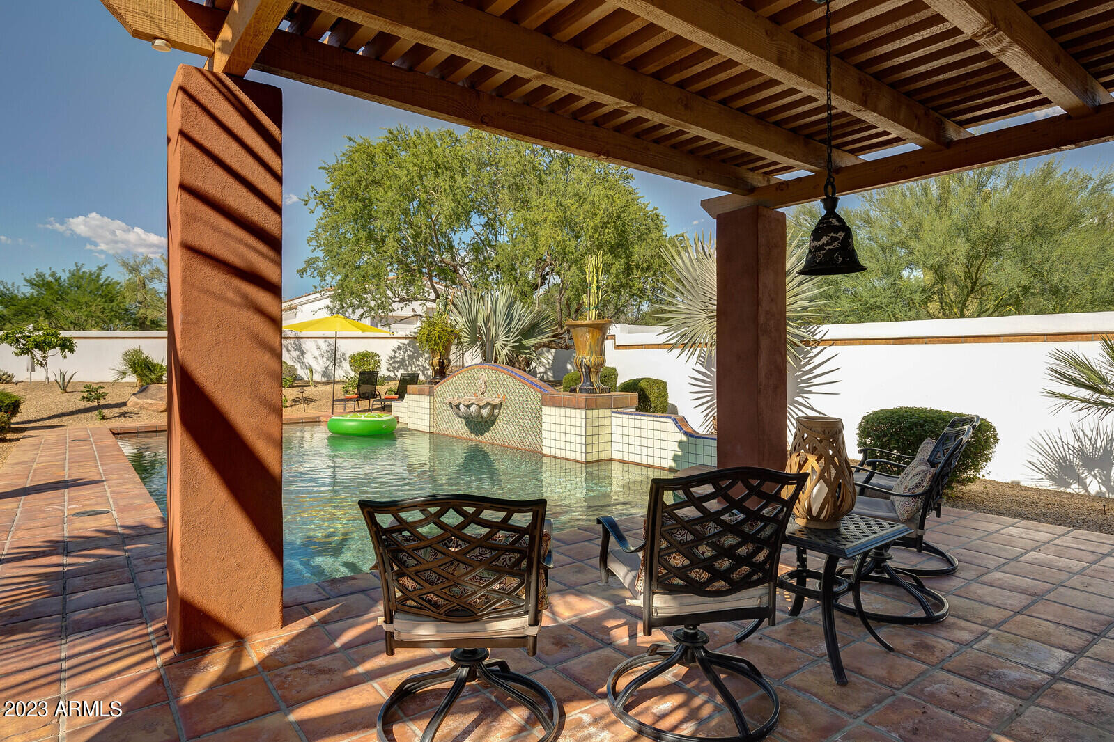 8161 East Alameda Road Scottsdale, AZ 85255 - Photo 73 of 107 a view of patio with table and chairs and potted plants
