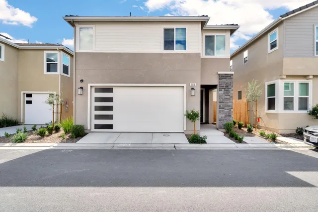 a street with a white house