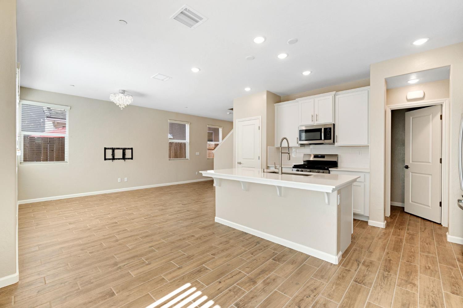 1116 Encore Way West Madera, CA 93636 - Photo 11 of 35 a kitchen with stainless steel appliances a refrigerator sink and microwave