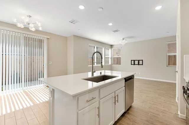 a kitchen with a sink and cabinets