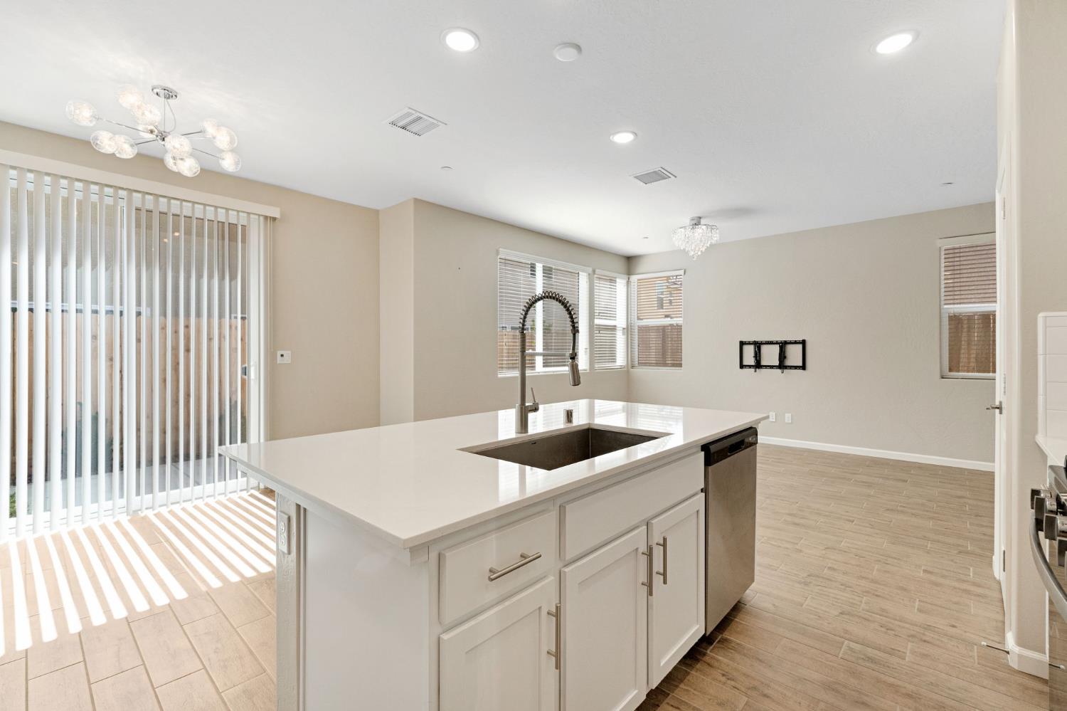 1116 Encore Way West Madera, CA 93636 - Photo 13 of 35 a kitchen with a sink and cabinets