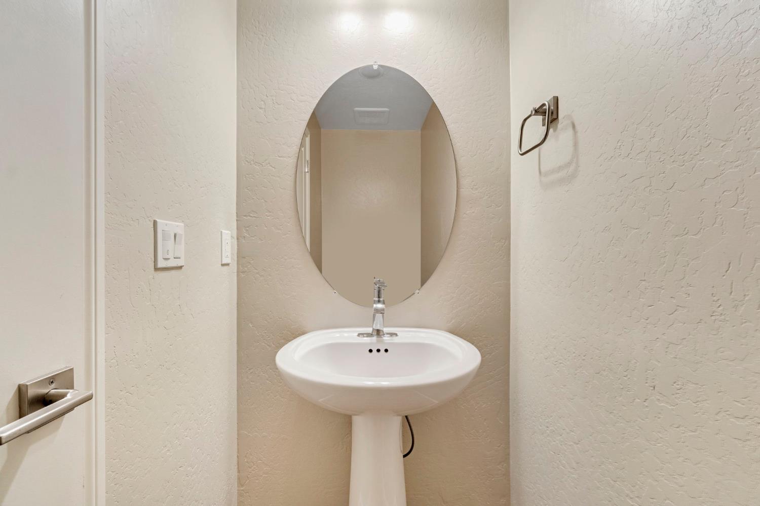 1116 Encore Way West Madera, CA 93636 - Photo 15 of 35 a bathroom with a sink and a mirror
