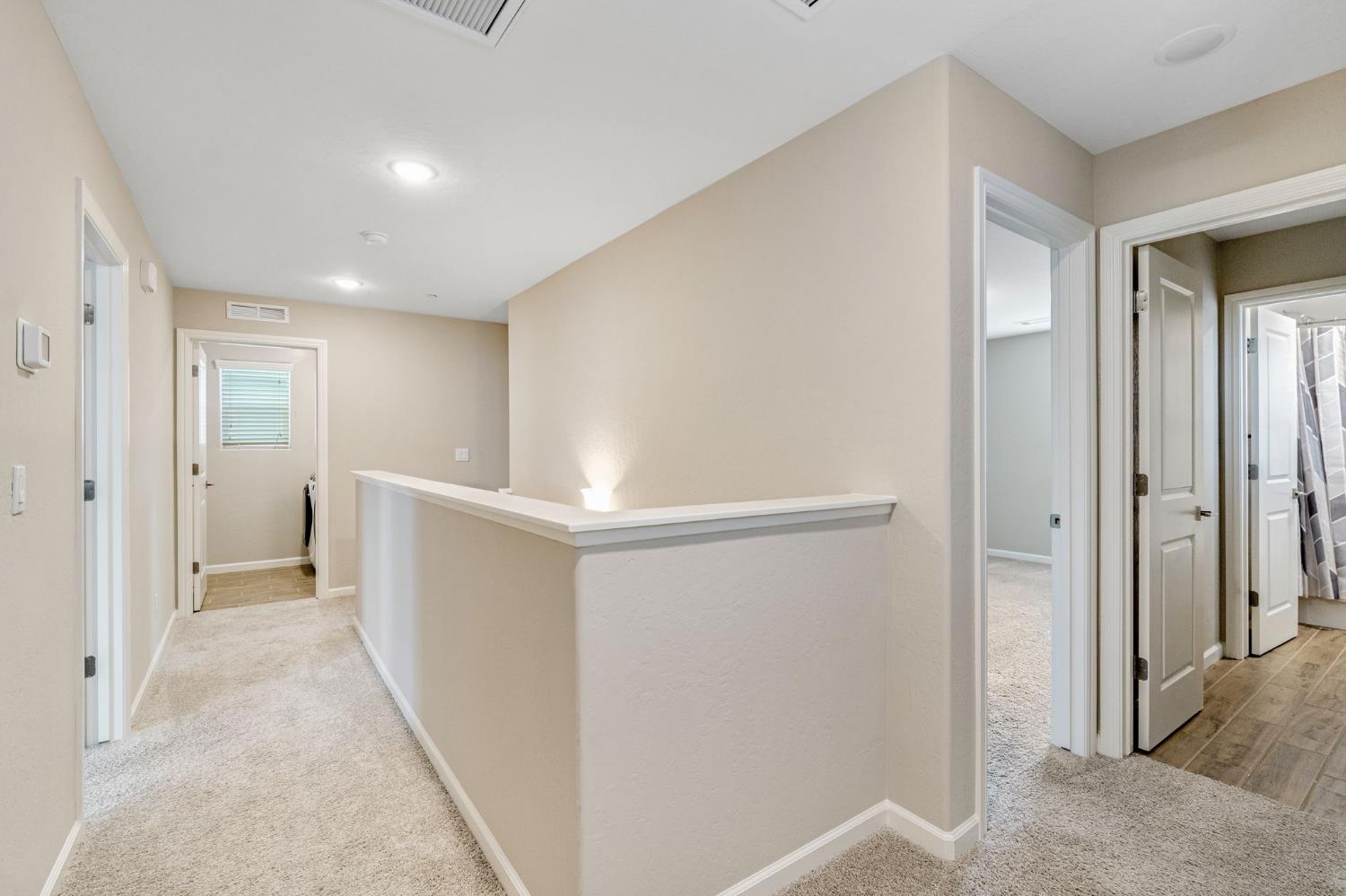1116 Encore Way West Madera, CA 93636 - Photo 17 of 35 a view of a hallway with wooden shelves