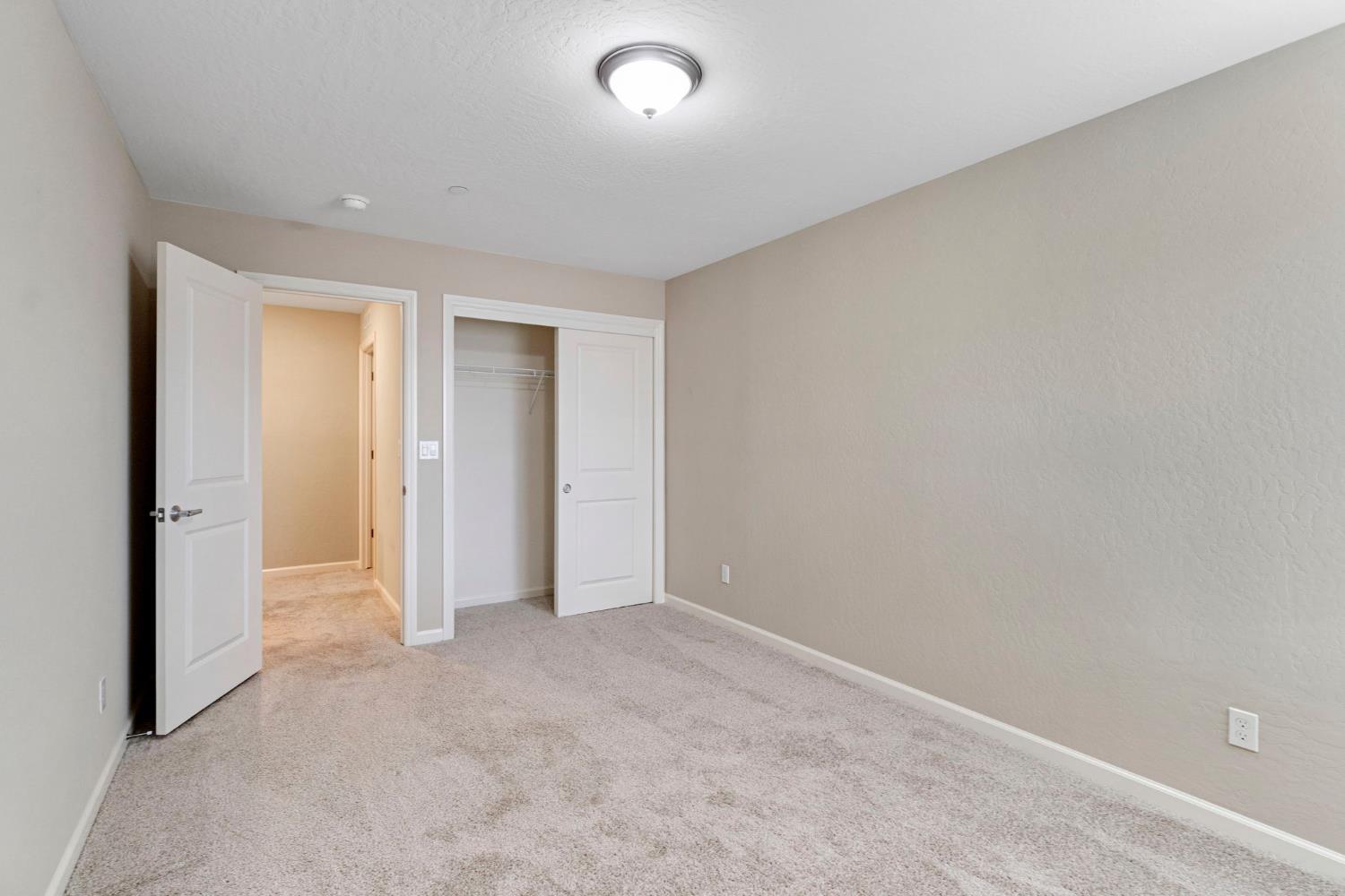 1116 Encore Way West Madera, CA 93636 - Photo 23 of 35 an empty room with closet area