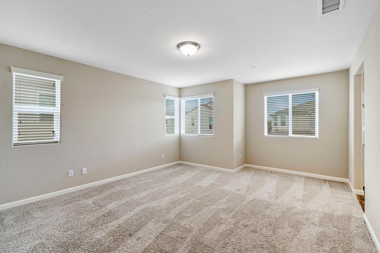1116 Encore Way West Madera, CA 93636 - Photo 24 of 35 a view of an empty room with a window