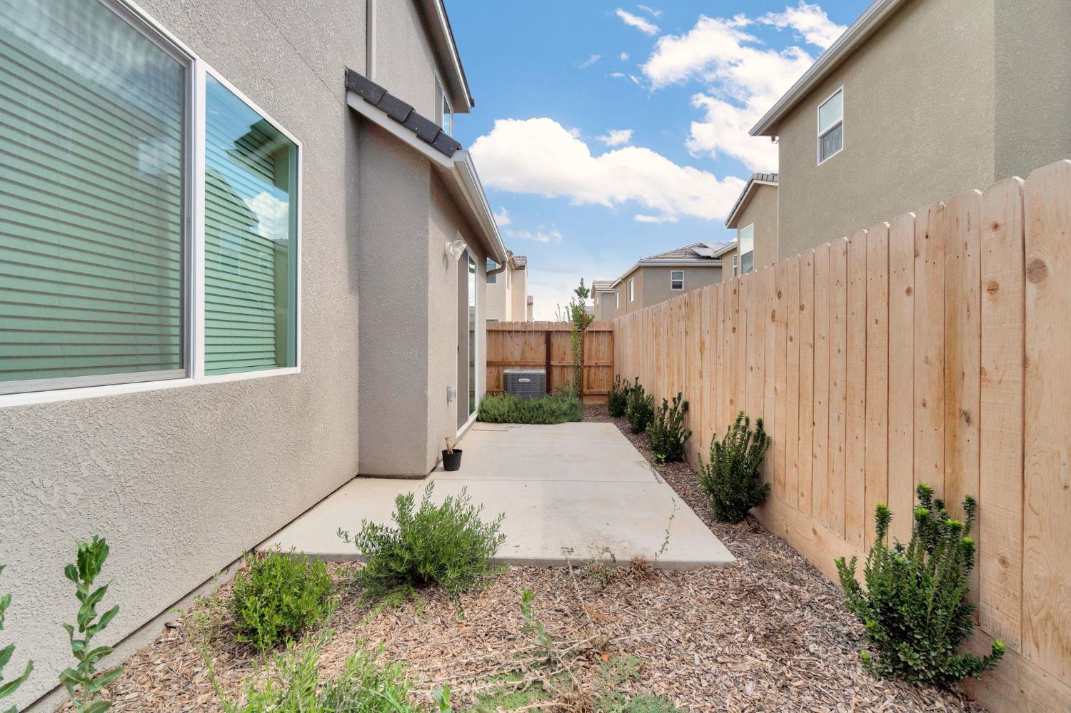 1116 Encore Way West Madera, CA 93636 - Photo 30 of 35 a view of a backyard with potted plants
