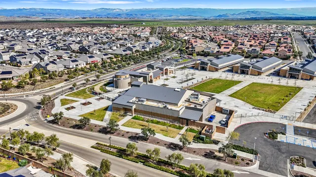 an aerial view of a house with a ocean view