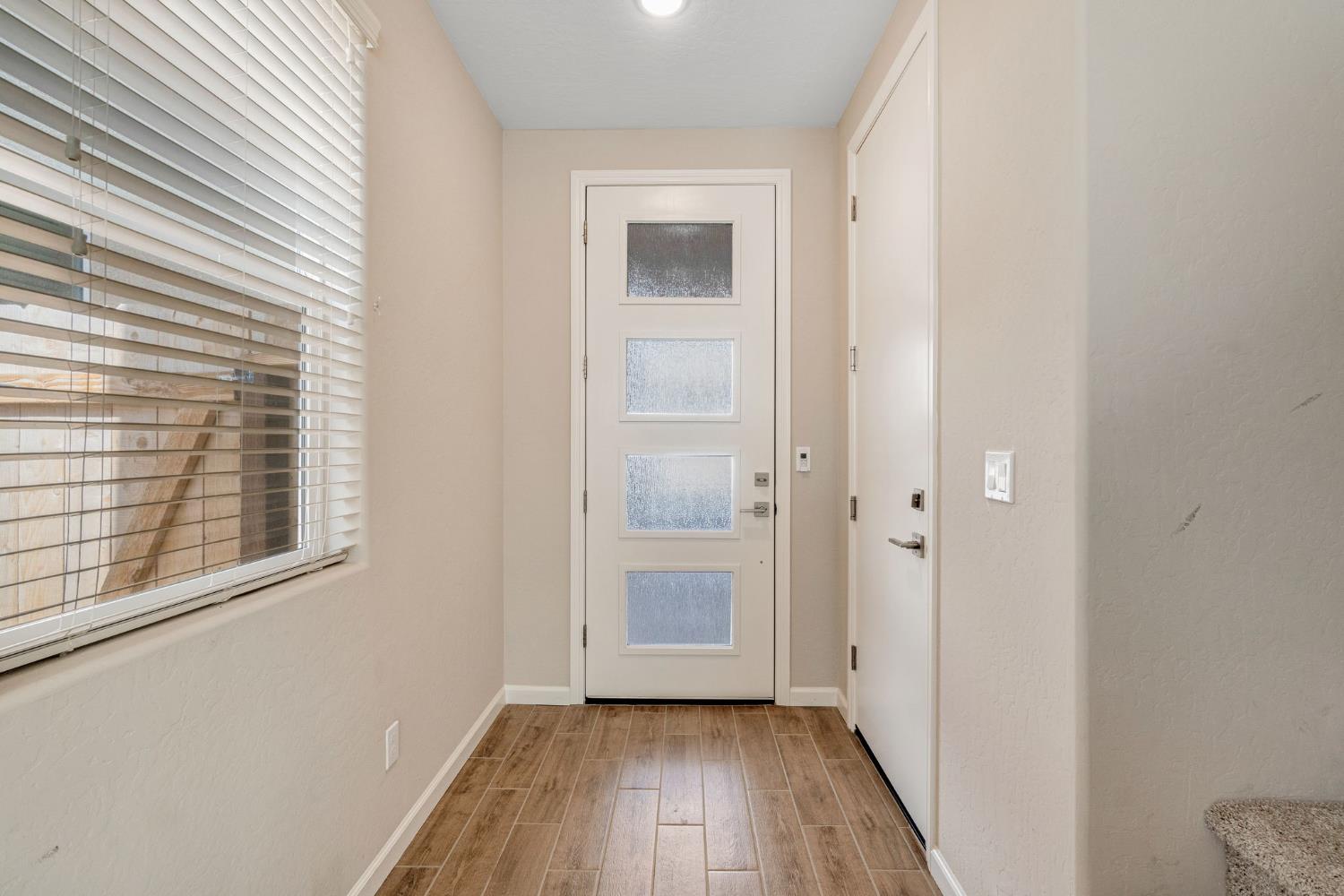 1116 Encore Way West Madera, CA 93636 - Photo 5 of 35 a view of a hallway with wooden floor and closet