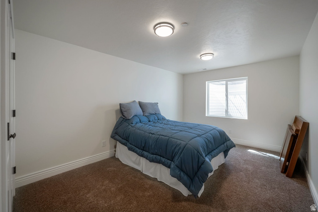 1288 North Horizon View Loop Elk Ridge, UT 84651 - Photo 34 of 40 Carpeted bedroom featuring baseboards