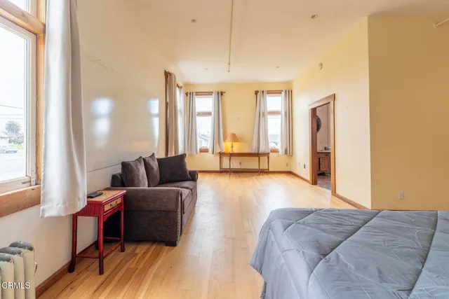 a view of a terrace with a table and chairs