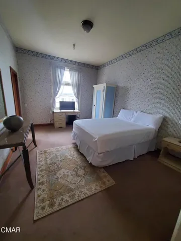 a bathroom with a sink a mirror and a window