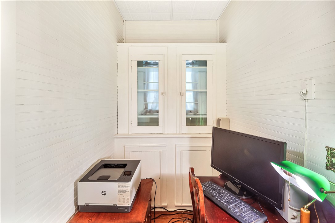 205 West Mauldin Street Walhalla, SC 29691 - Photo 10 of 43 A well-lit, compact home office offers a dedicated space for productivity. Connected to the kitchen, this space can also serve as a second pantry or extension of the kitchen or dining area.