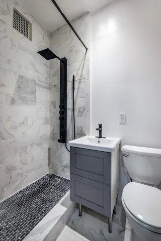 a stove top oven sitting inside of a kitchen