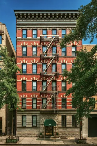 a view of a chairs and table in the balcony