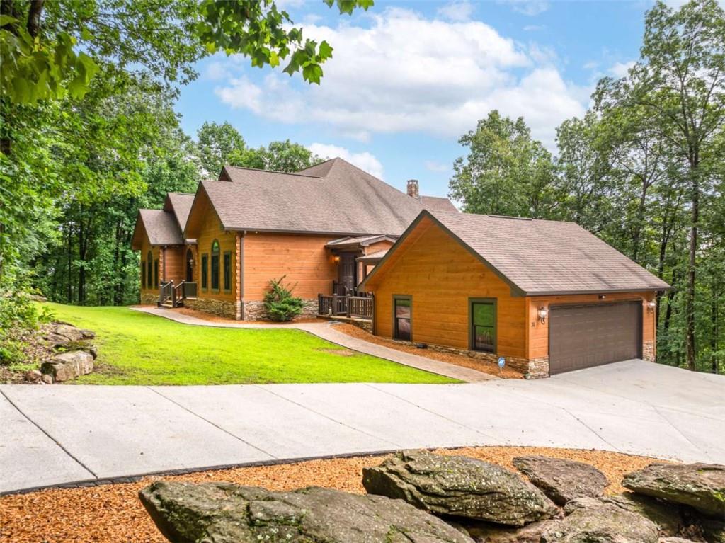 31 High Cliff Road Jasper, GA 30143 - Photo 14 of 23 a yellow and red house with a yard