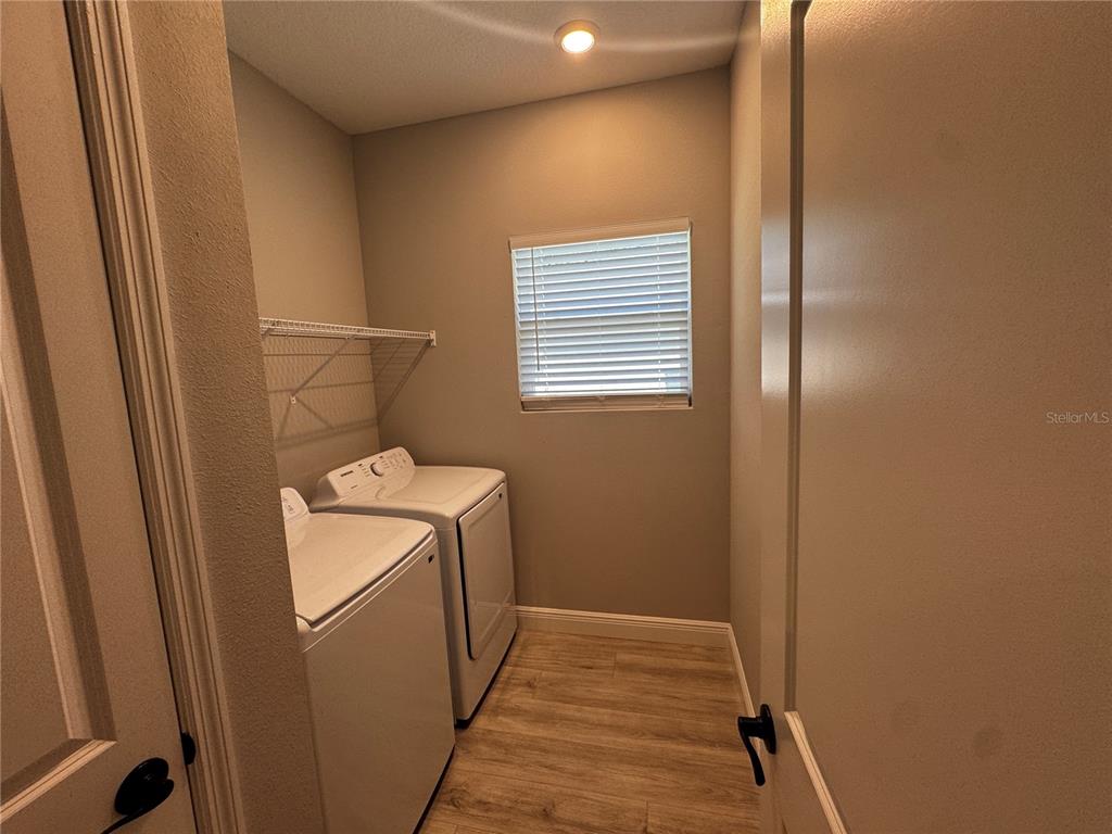 13101 Southwest 72nd Terrace Road Ocala, FL 34473 - Photo 15 of 18 a utility room with dryer and washer