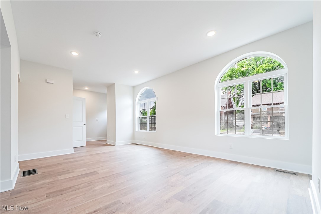 1839 Farmington Road Cleveland, OH 44112 - Photo 6 of 29 Living room with light wood-look flooring and recessed lighting