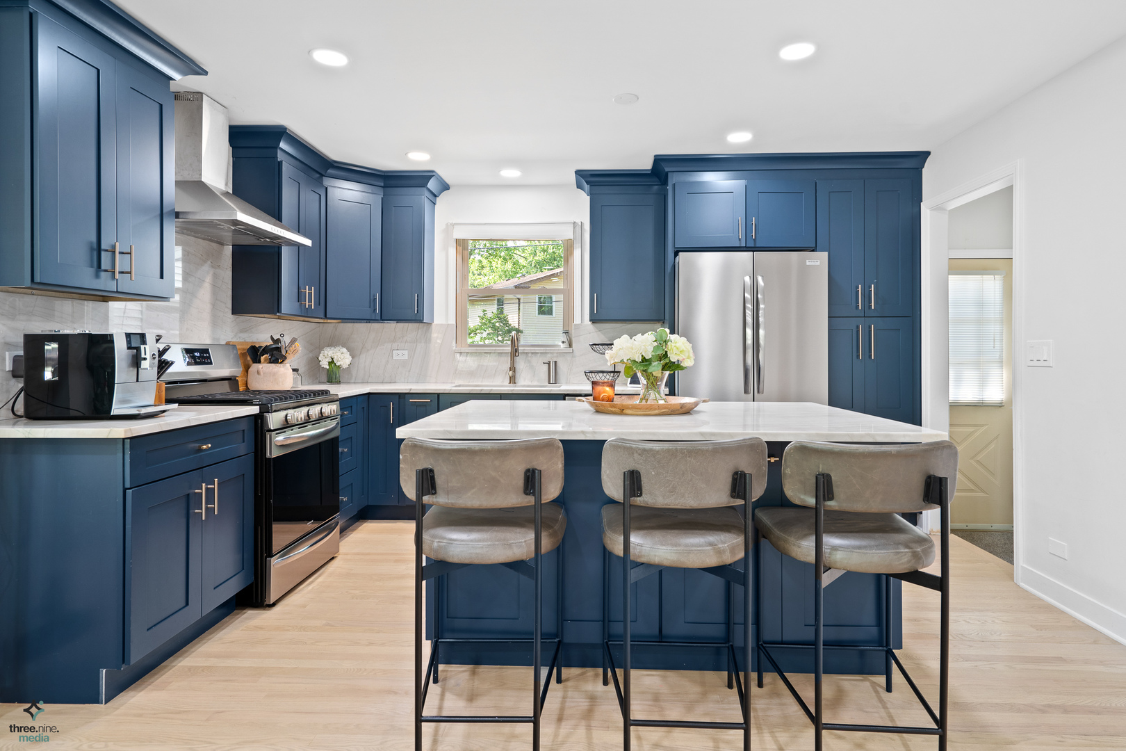 433 West Gartner Road Naperville, IL 60540 - Photo 2 of 29 a kitchen with stainless steel appliances a dining table chairs refrigerator and sink