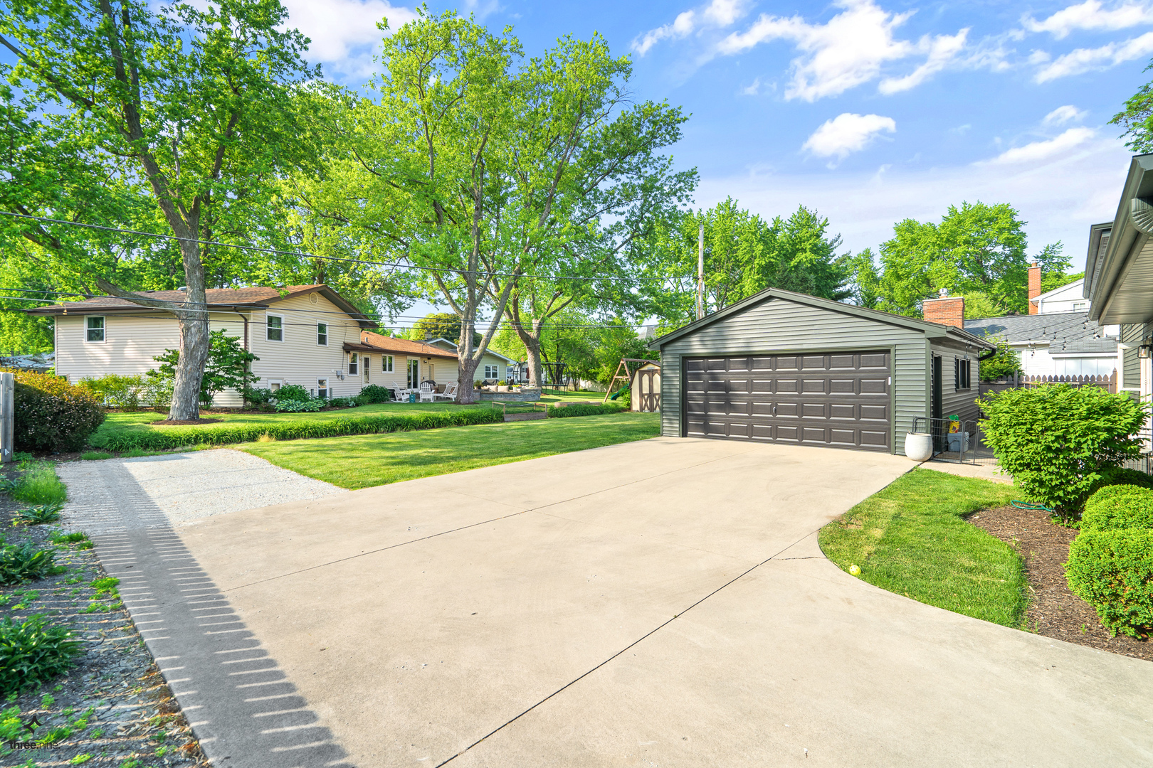 433 West Gartner Road Naperville, IL 60540 - Photo 21 of 29 a front view of a house with a garden and yard