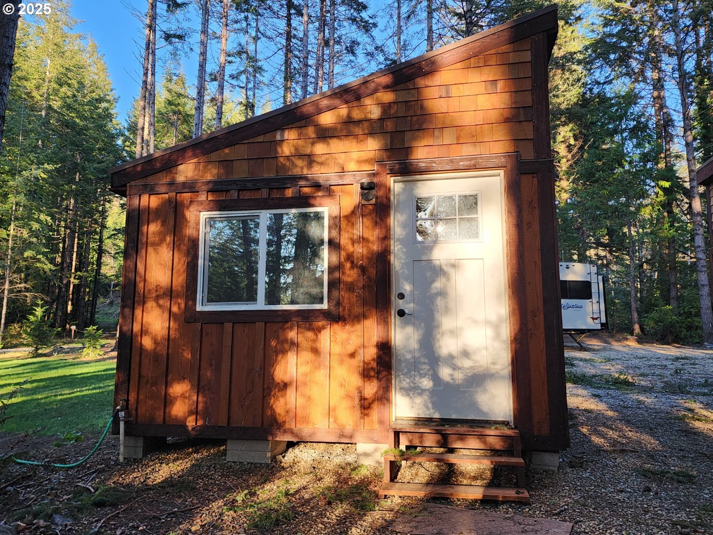Orchard Road, Unit 3 Port Orford, OR 97465 - Photo 12 of 32 a front view of house with a yard