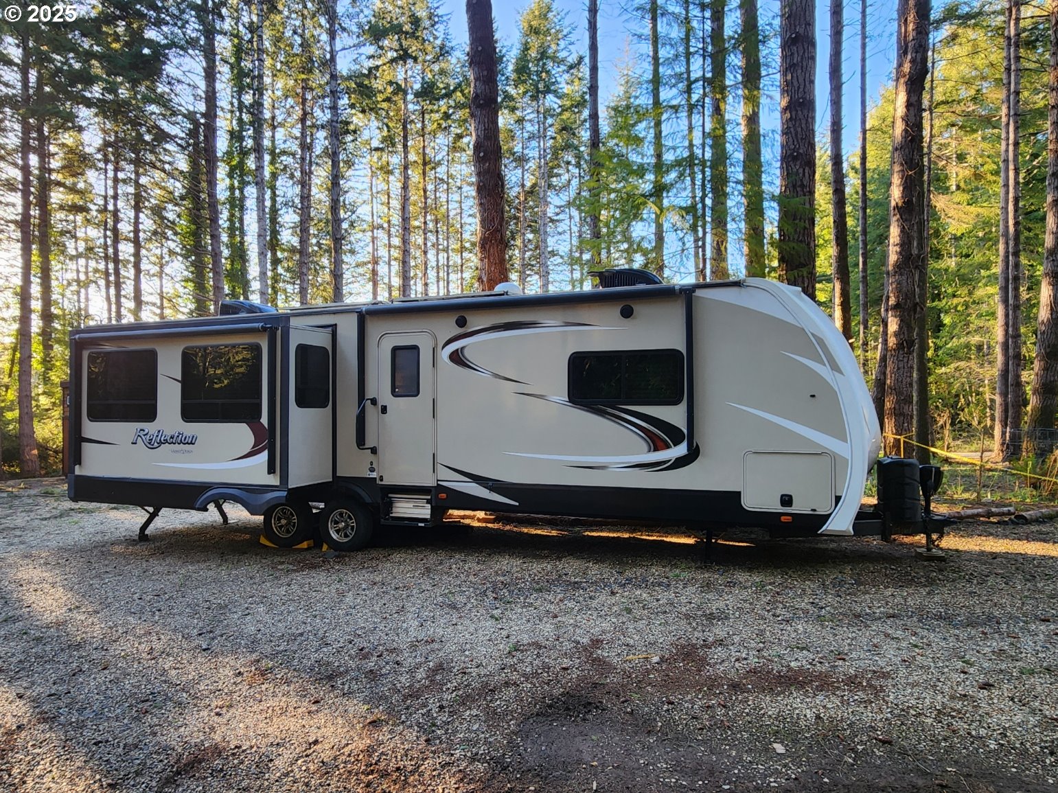 Orchard Road, Unit 3 Port Orford, OR 97465 - Photo 21 of 32 a white house covered with tall trees