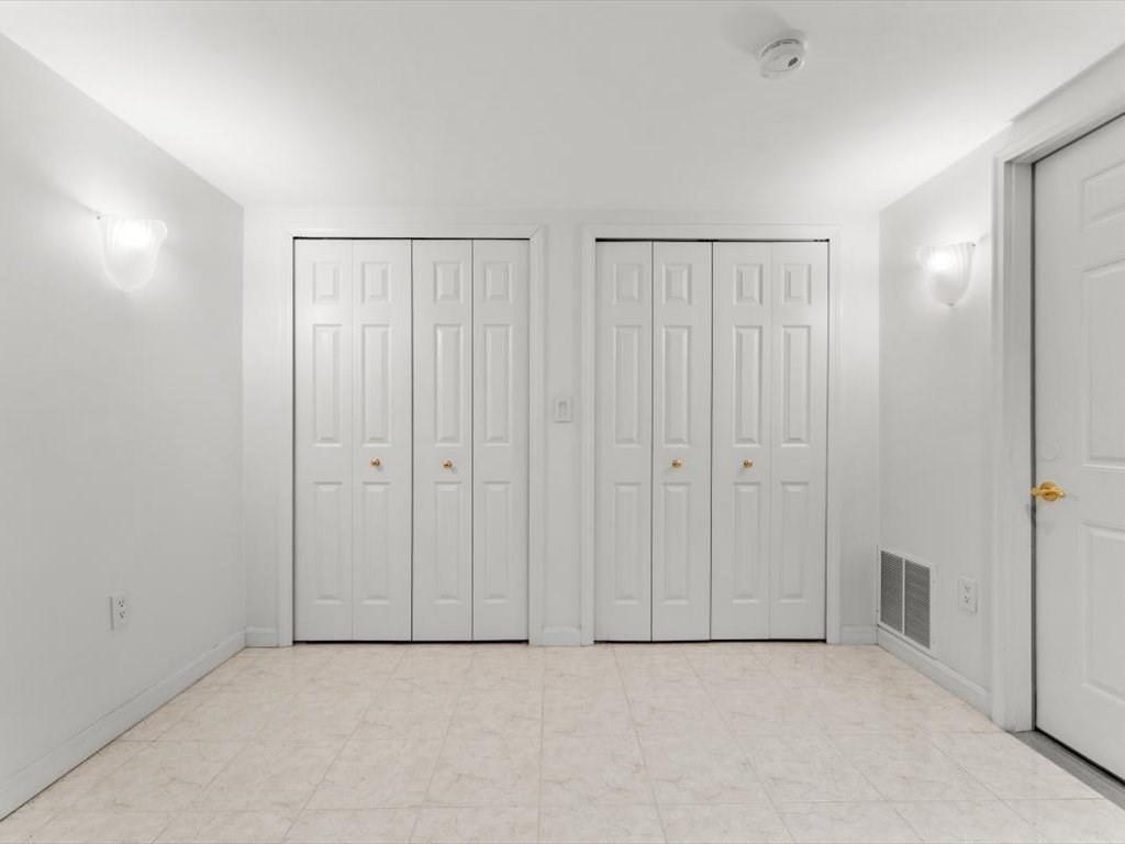29 Deer Path, Unit 29 Hudson, MA 01749 - Photo 35 of 42 an empty room with a entryway