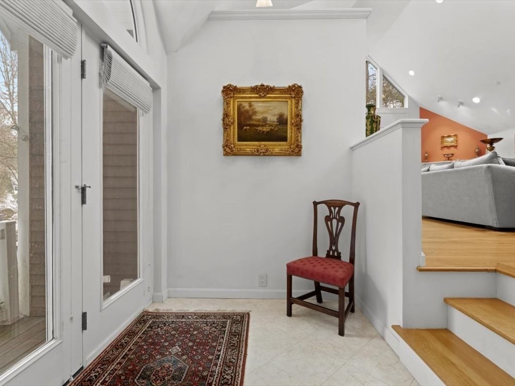 29 Deer Path, Unit 29 Hudson, MA 01749 - Photo 36 of 42 a living room with furniture and a rug