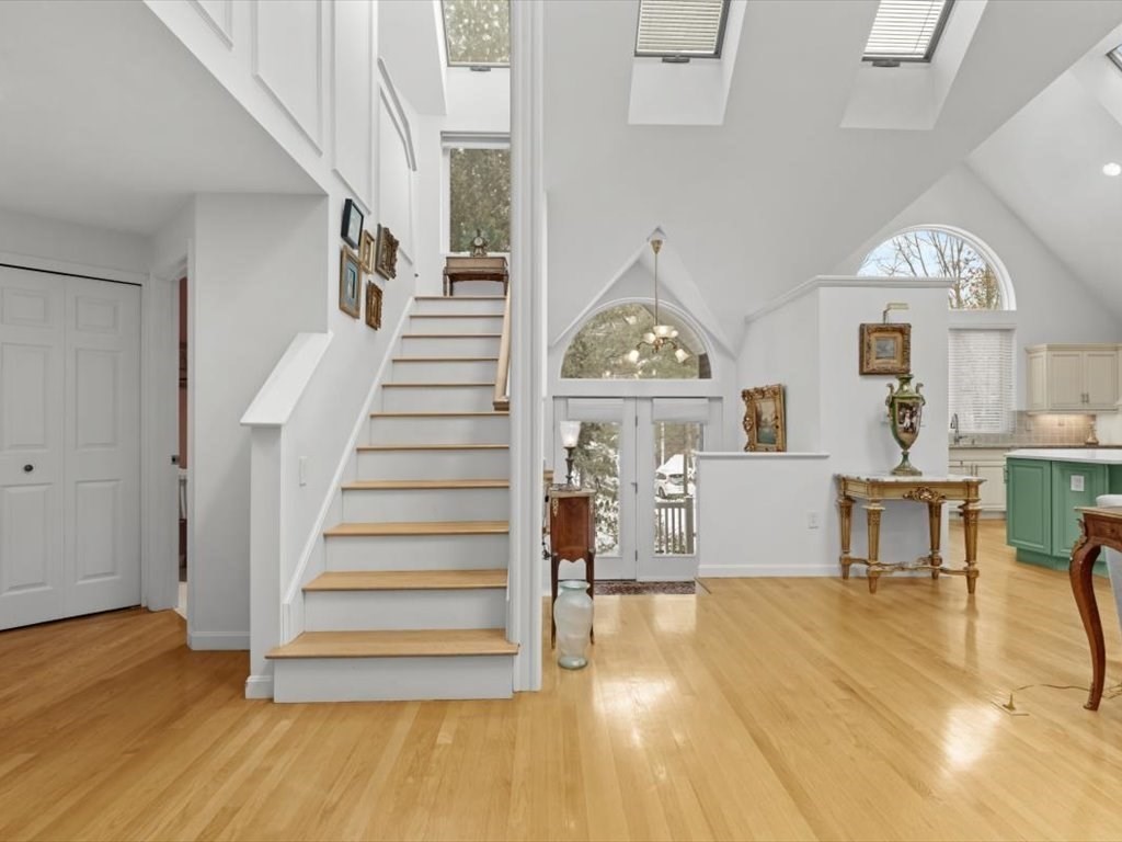 29 Deer Path, Unit 29 Hudson, MA 01749 - Photo 6 of 42 a view of entryway and hall with wooden floor