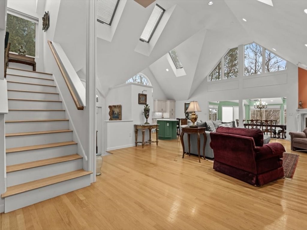 29 Deer Path, Unit 29 Hudson, MA 01749 - Photo 6 of 42 a living room with furniture and a chandelier