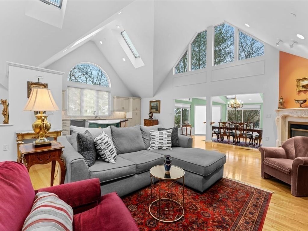 29 Deer Path, Unit 29 Hudson, MA 01749 - Photo 9 of 42 a living room with furniture wooden floor and a large window
