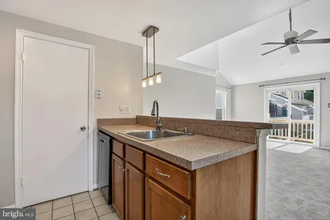 a view of a kitchen from a hallway