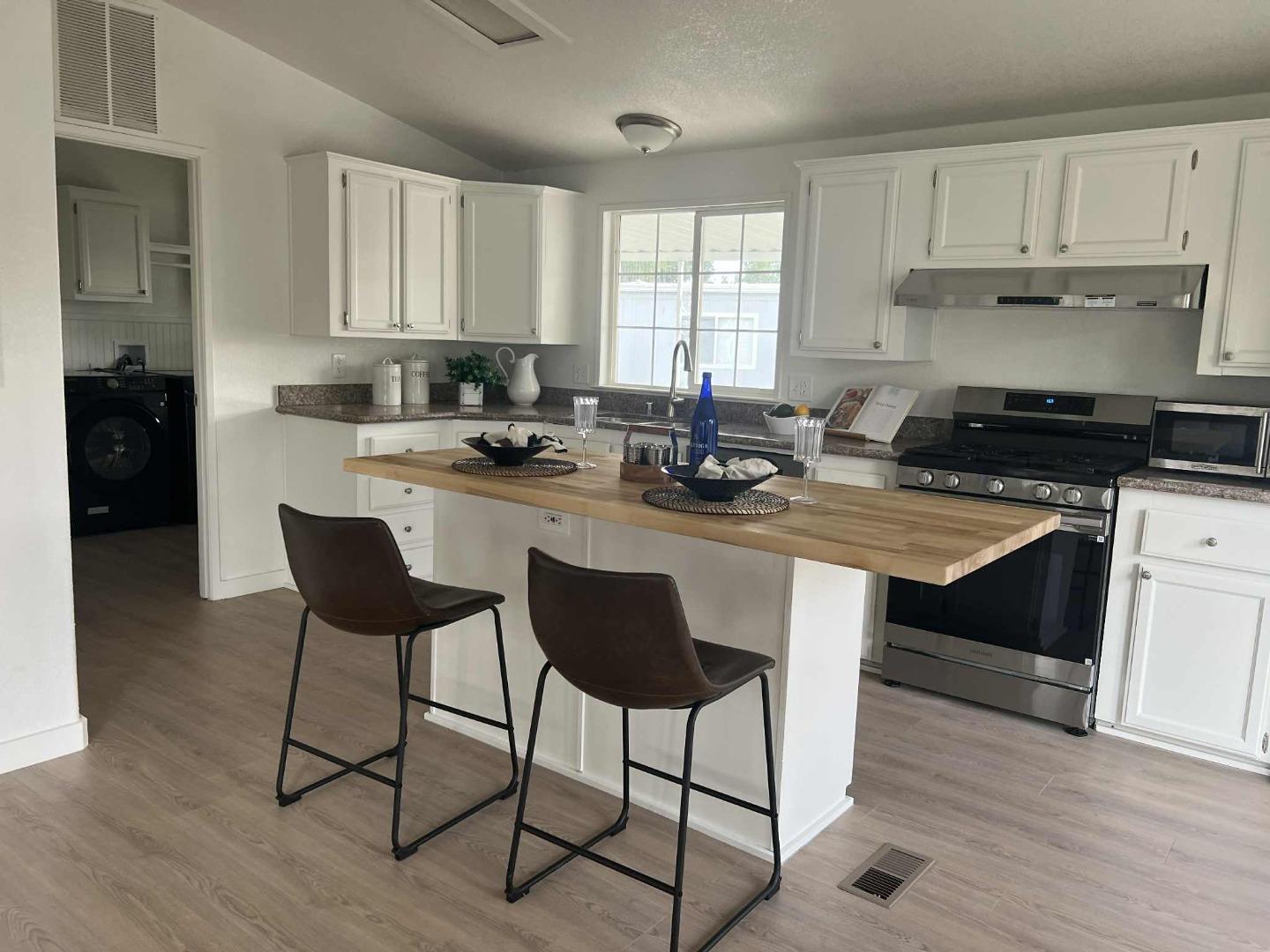 2151 Oakland Rd Space, Unit 46 San Jose, CA 95131 - Photo 6 of 13 a kitchen with a sink cabinets and window