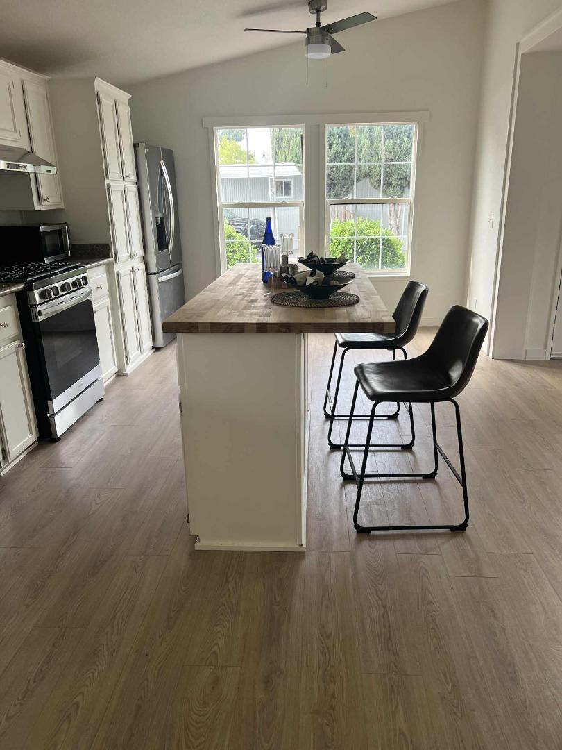 2151 Oakland Rd Space, Unit 46 San Jose, CA 95131 - Photo 7 of 13 a dining room with furniture and a window