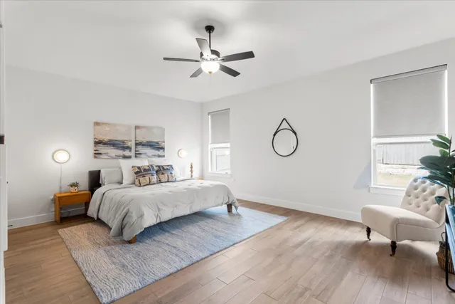 a bedroom with a bed and window