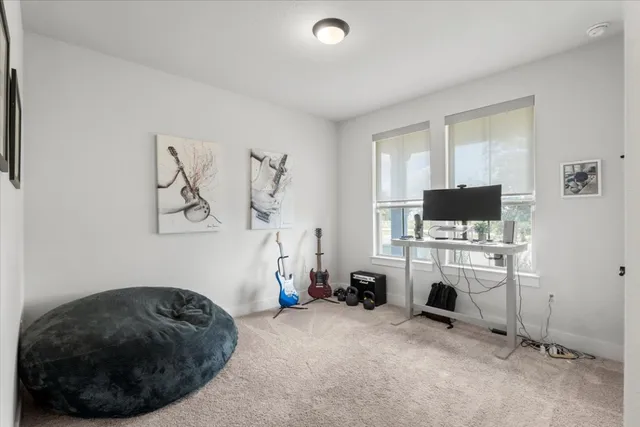 a room with a couch and a flat screen tv