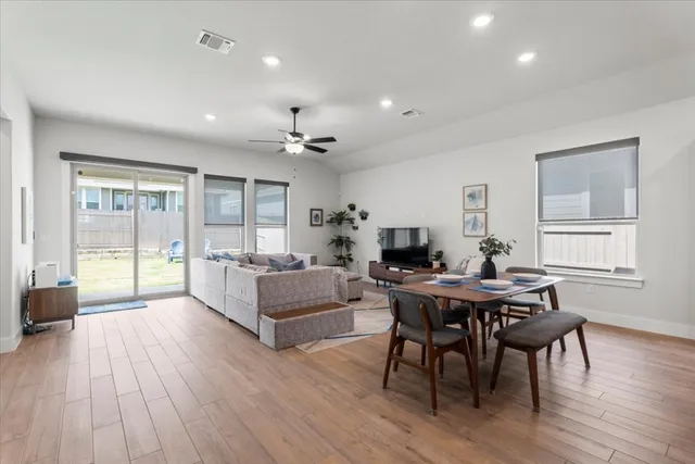 a view of a dining room with furniture window and wooden floor