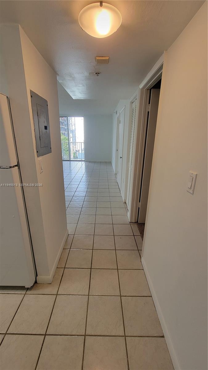 126 Southwest 17th Road, Unit 507 Miami, FL 33129 - Photo 4 of 13 a view of a hallway in a house