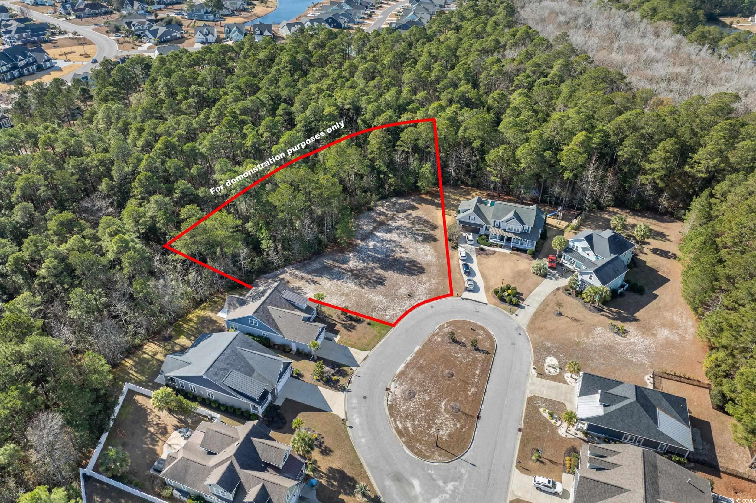 2908 Moss Bridge Lane Myrtle Beach, SC 29579 - Photo 13 of 35 Aerial view of residential area with a forest. Boundary lines are for demonstration purposes only and should be verified