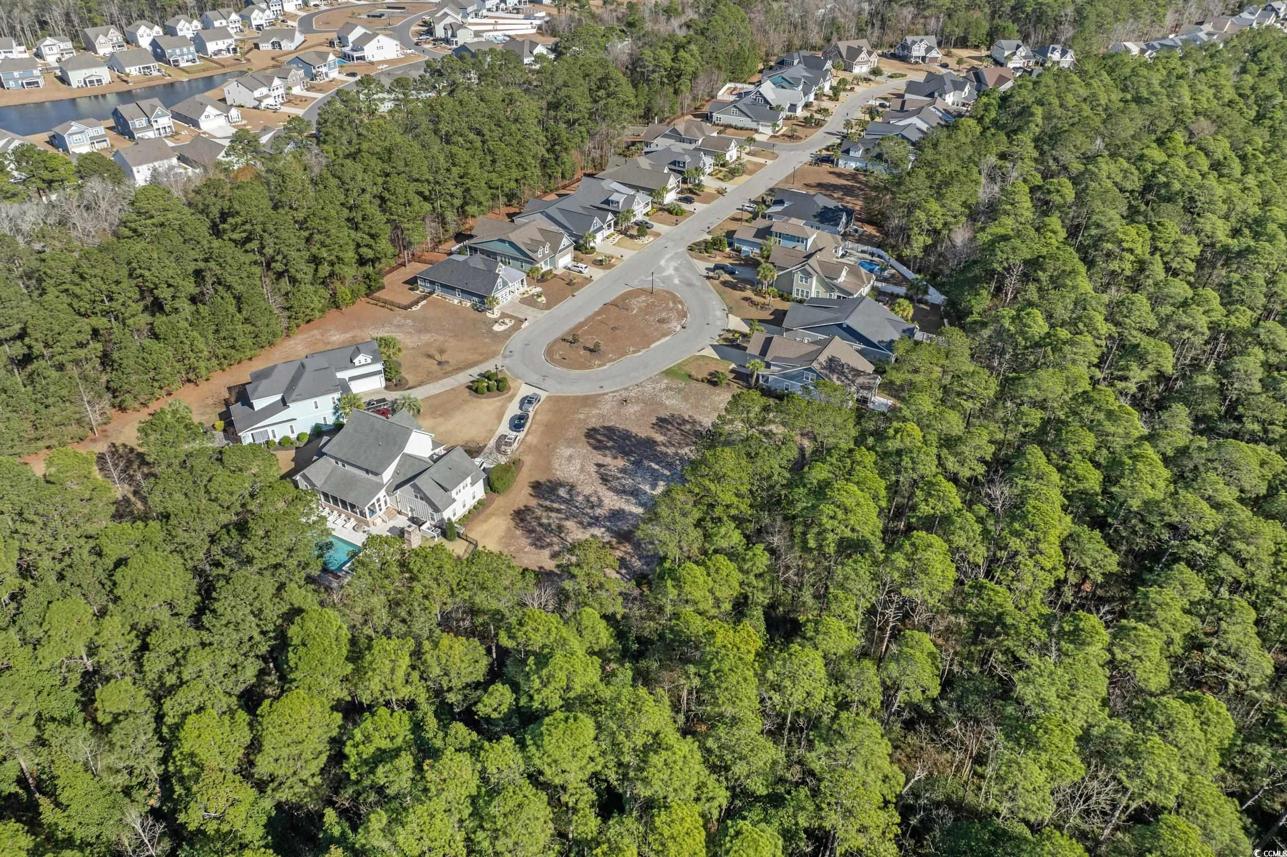 2908 Moss Bridge Lane Myrtle Beach, SC 29579 - Photo 14 of 35 Aerial overview of property's location featuring nearby suburban area and a tree filled landscape